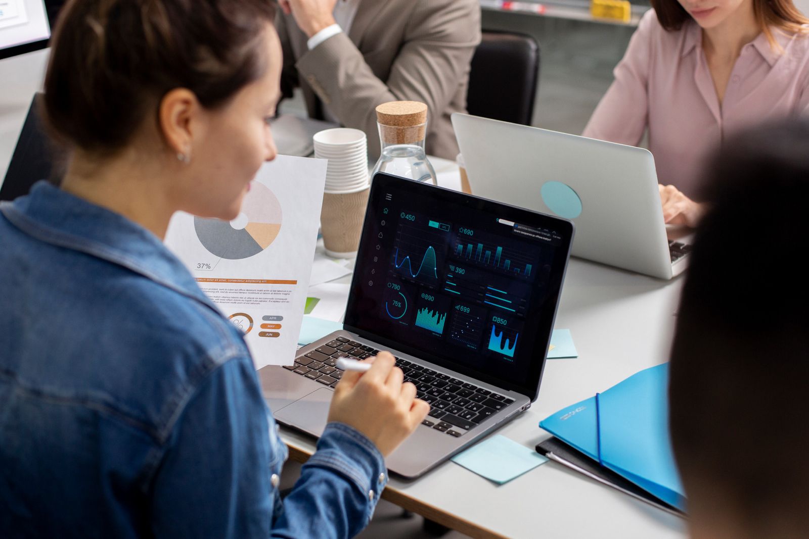Analyst looking at data visualisations on screen